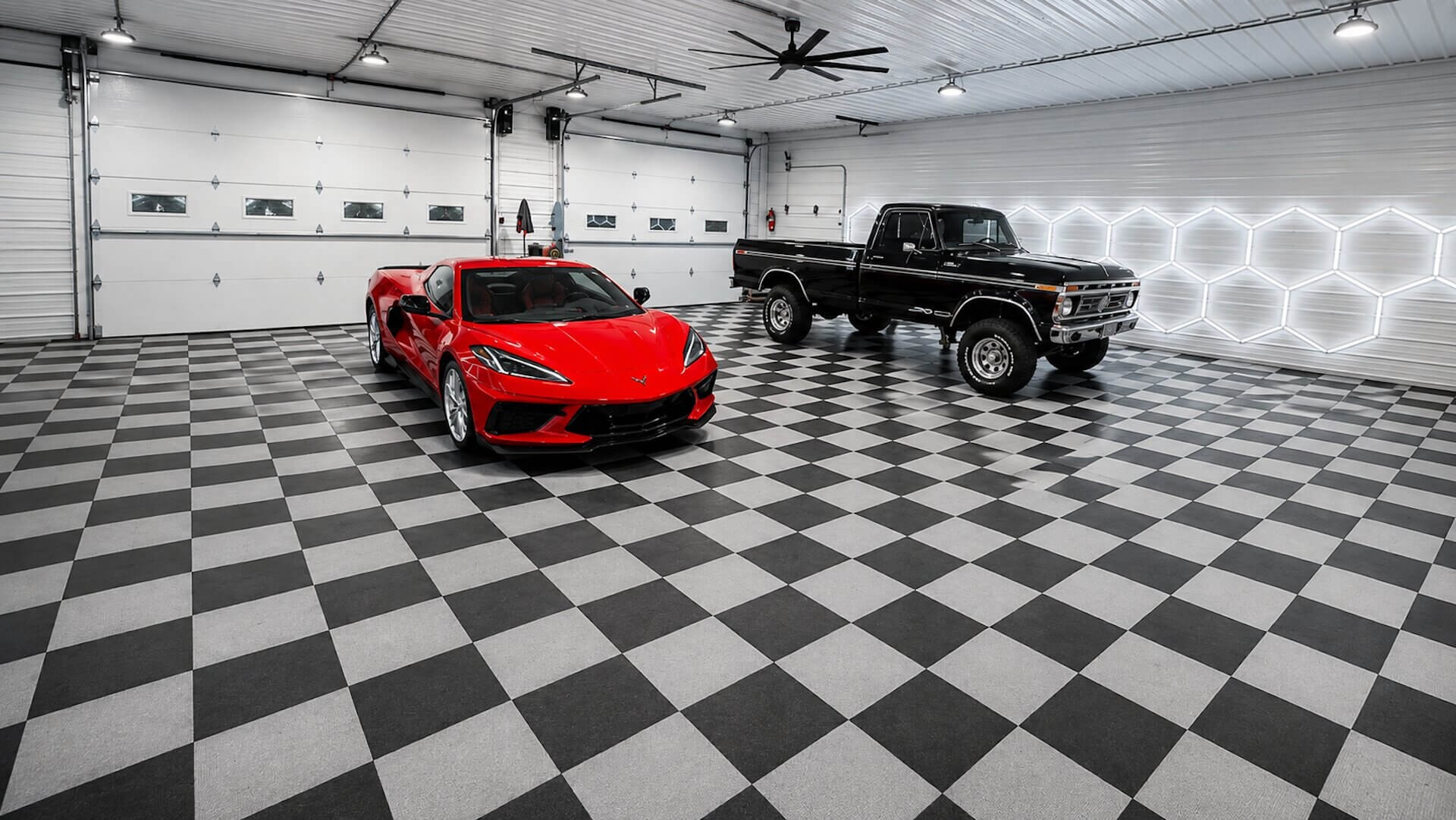 A C8 Corvette and a classic Ford truck in the Colby Co. bay